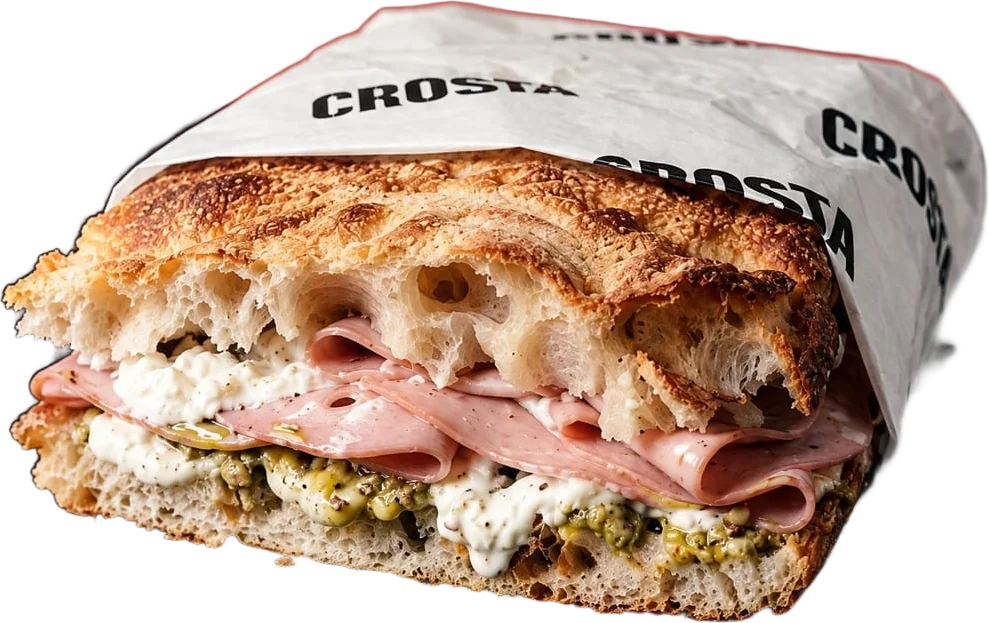 Mortadella schiacciata, wrapped in Crosta paper, cut open to show the filling