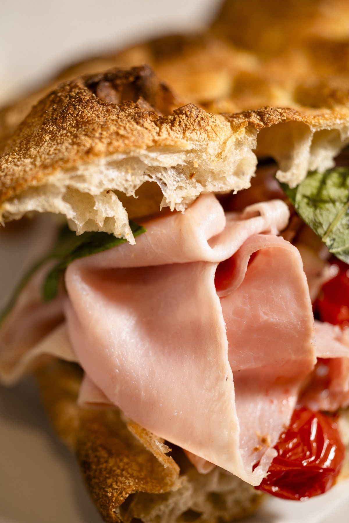 Schiacciata filled with mortadella, tomato confit and basil