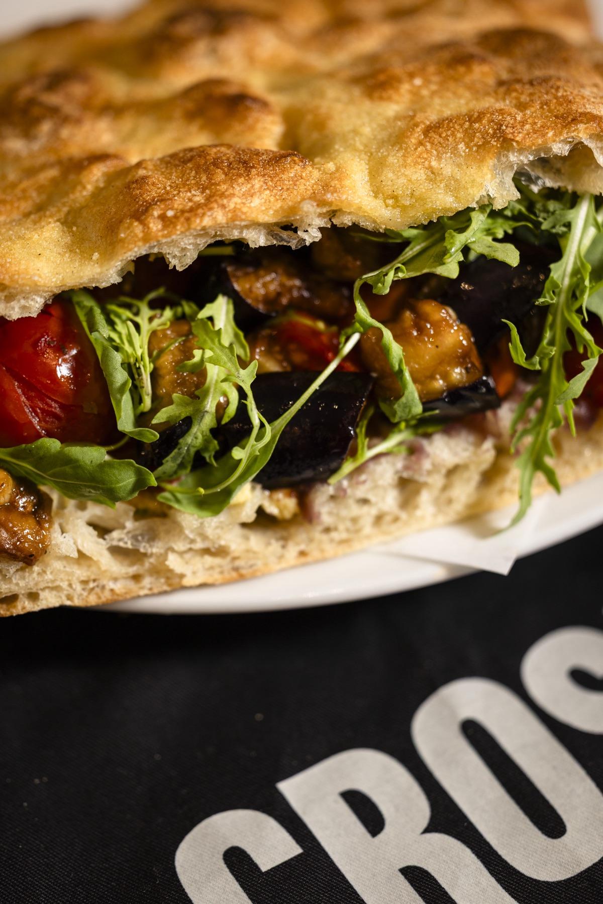 Schiacciata with roasted aubergine, tomato and rucola
