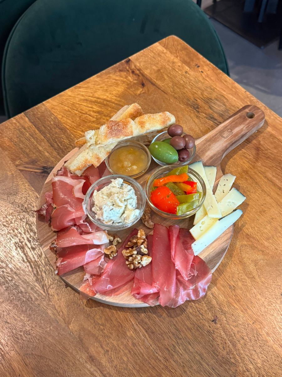 A Crosta tagliere with bresaola, prosciutto, cheese, olives, pickles and walnuts