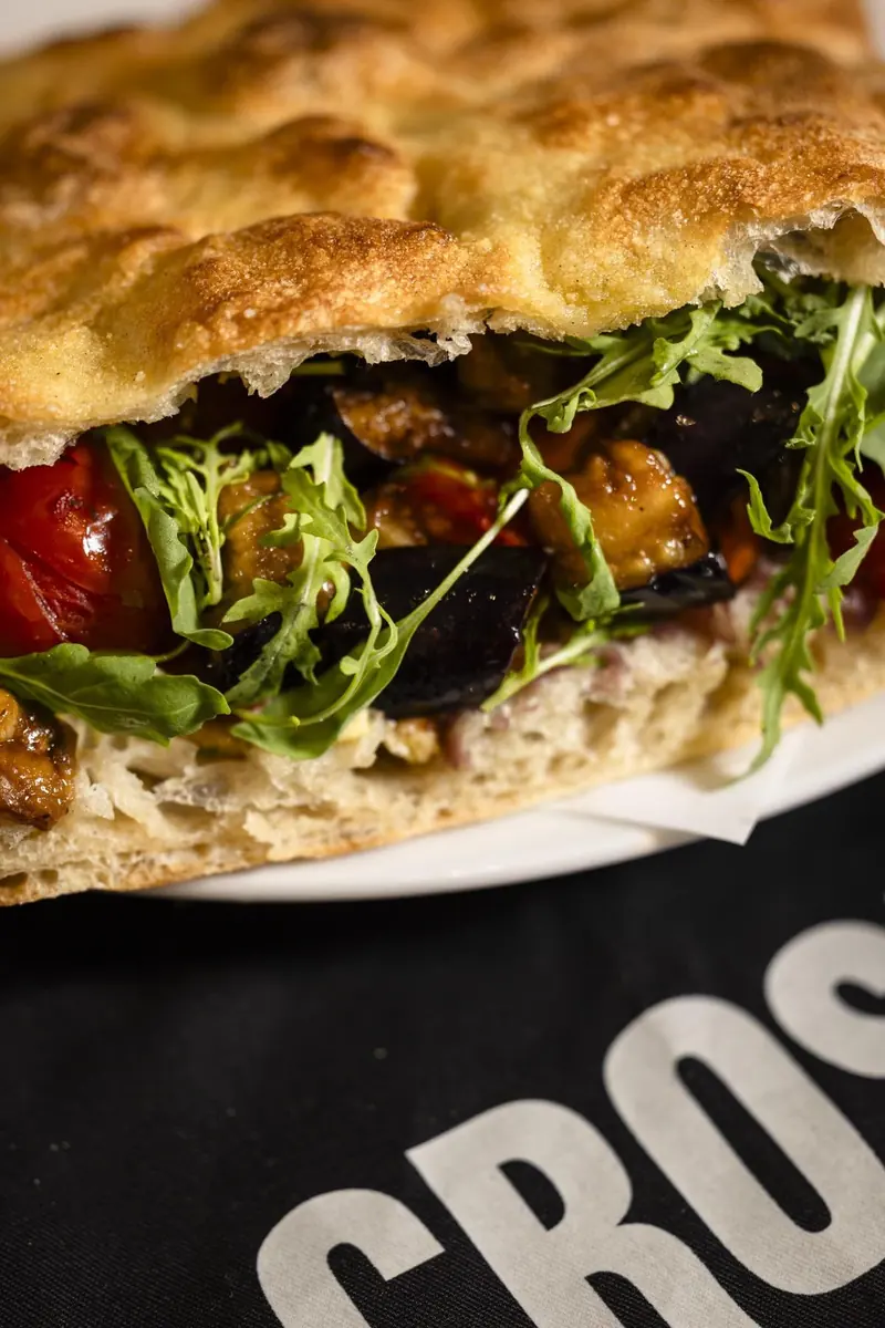 Schiacciata with roasted aubergine, tomato and rucola